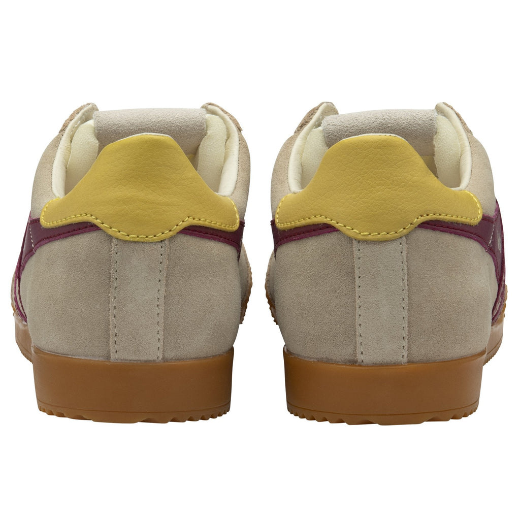 Rear view of a pair of Gola shoes with beige uppers and gold heel tabs.