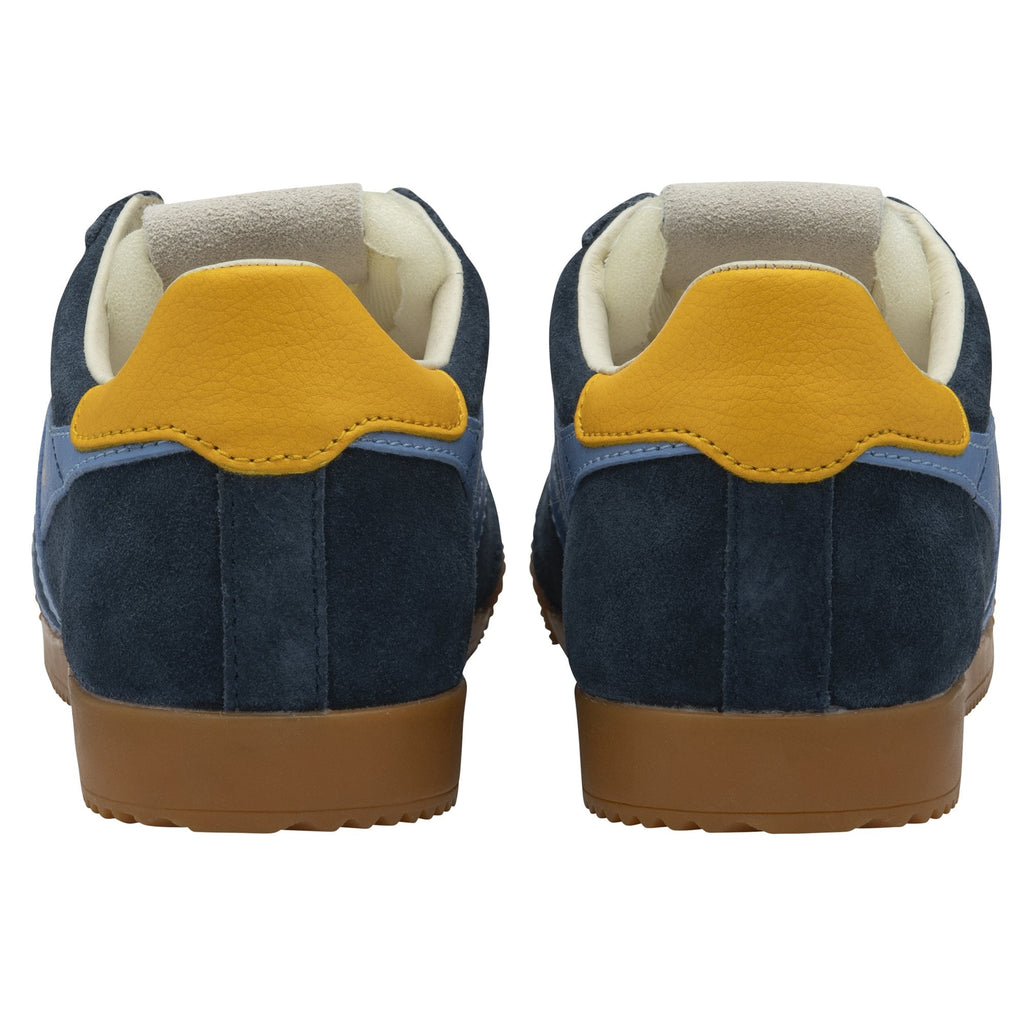 The back view of a pair of Gola Trainers in navy blue with yellow heels.