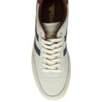 The toe of a white Gola trainer with blue stripes against a white background.