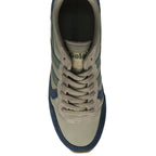 An overhead view of a recycled olive green and navy Gola sneaker with a white sole.
