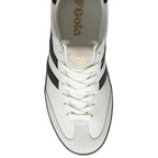 Top-down view of a white Gola sneaker with black stripes and white laces.