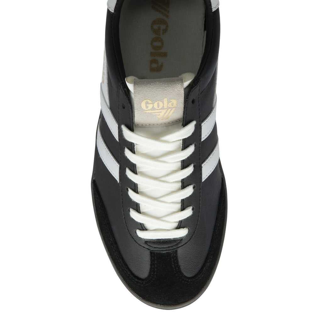 Top-down view of a black Gola men's trainer with white laces and stripes.