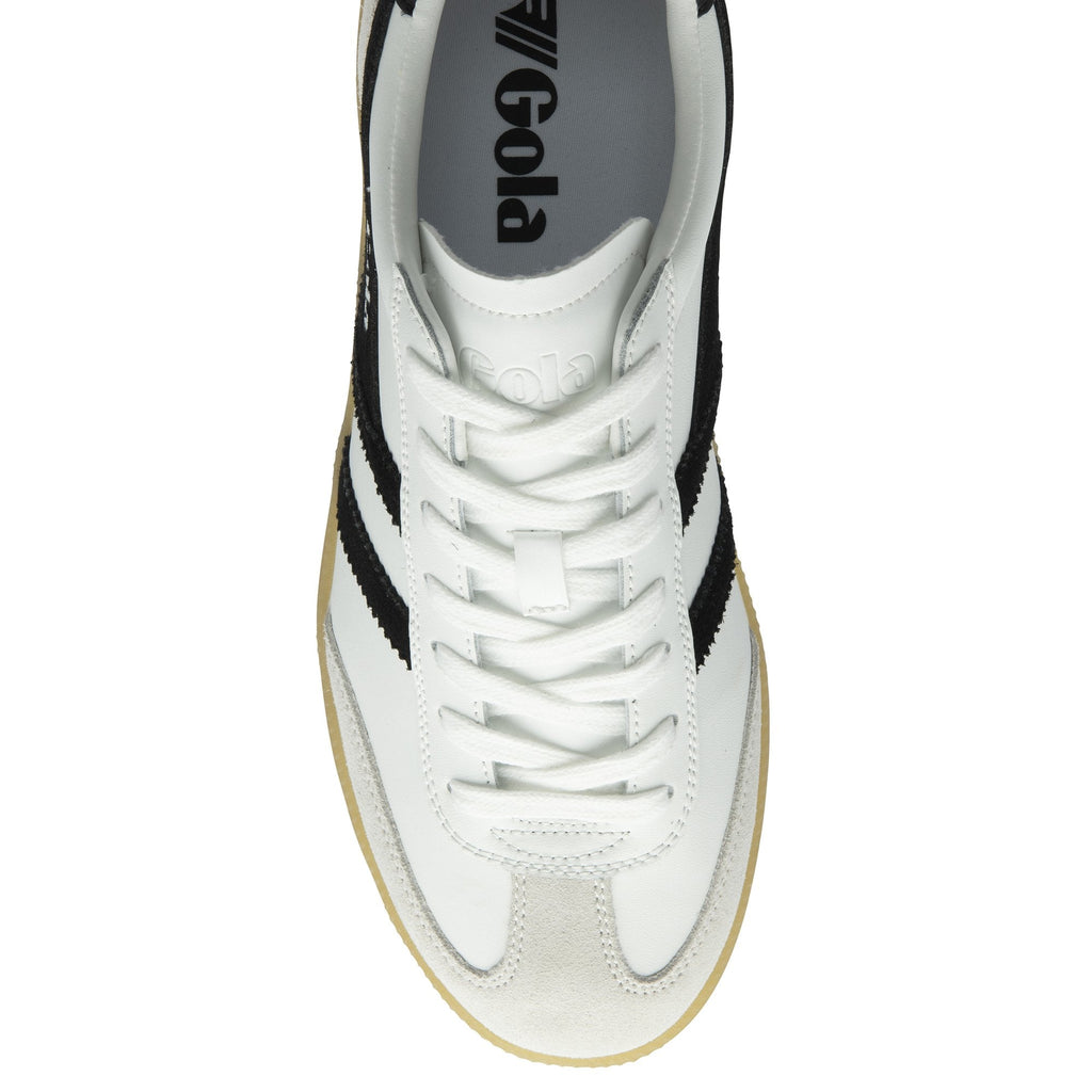Top-down view of a white Gola sneaker with black stripes and white laces.