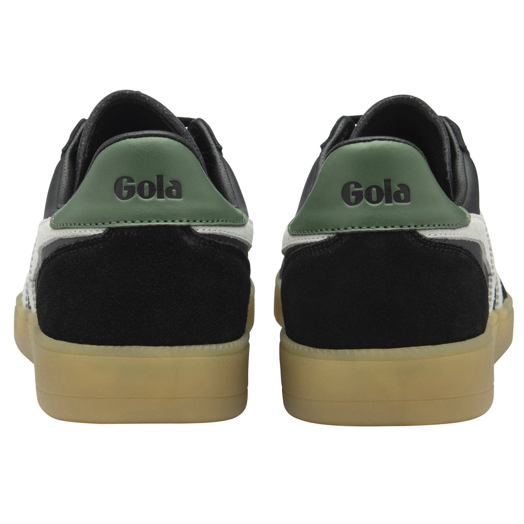 The backs of two black Gola sneakers with green heels and white accents.