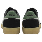 The backs of two black Gola sneakers with green heels and white accents.