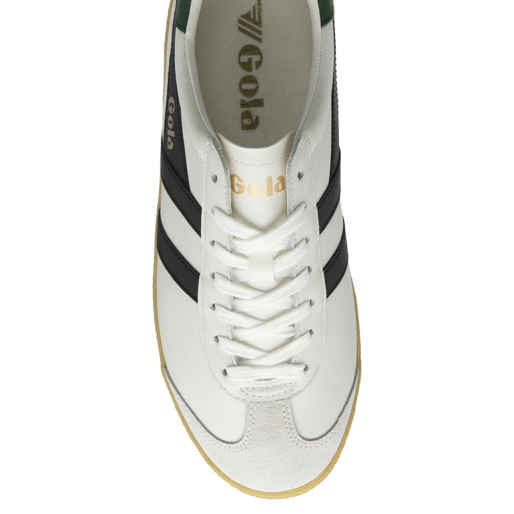 An overhead view of a single white Gola sneaker with black stripes and white laces.