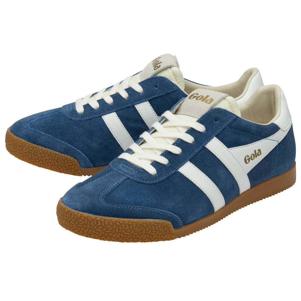 Pair of blue Gola trainers with white stripes and gum soles positioned at an angle.
