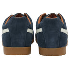 The back view of a pair of men's navy blue Gola Harrier suede trainers with white stripes.