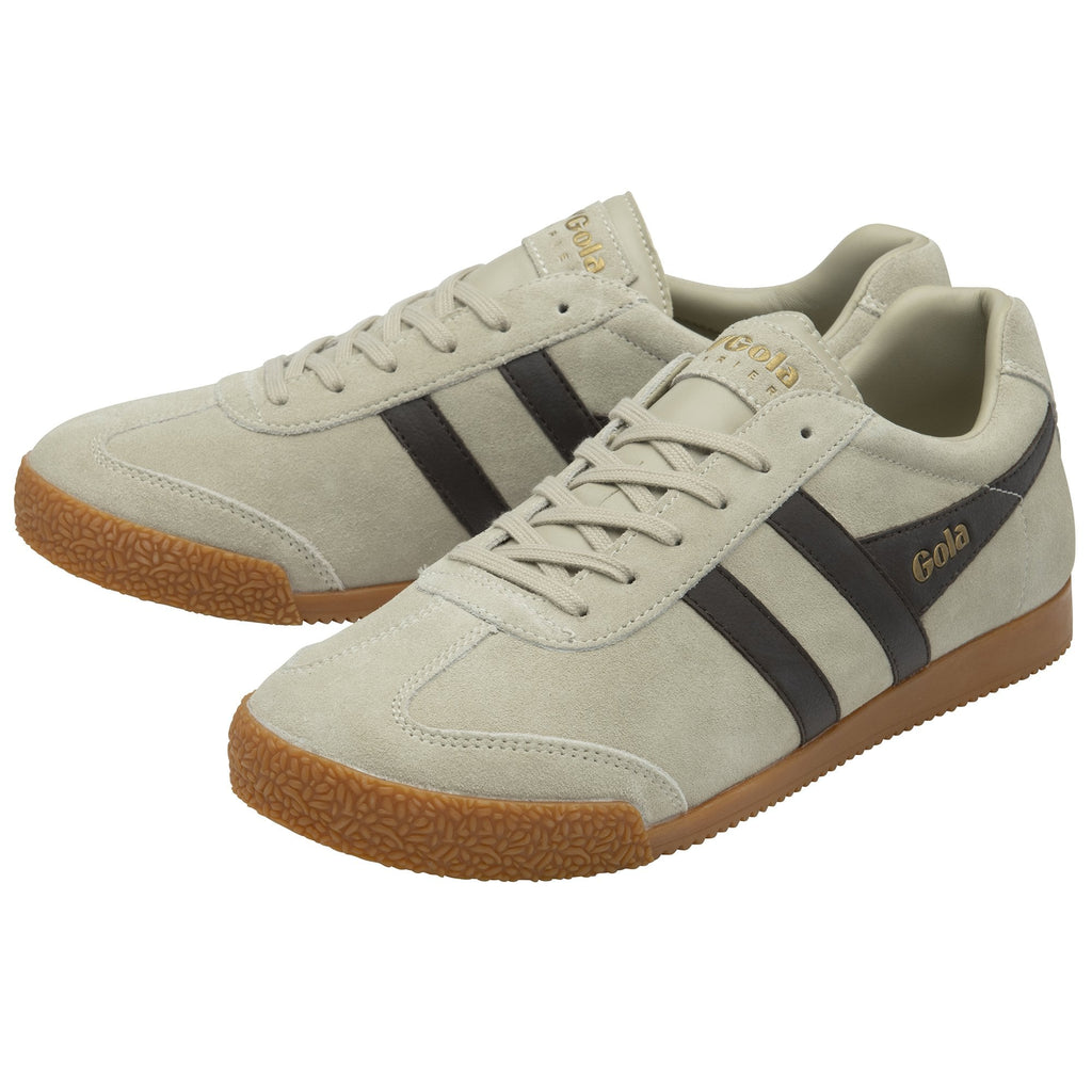 A pair of light grey Gola Harrier trainers with dark grey stripes and gum soles.