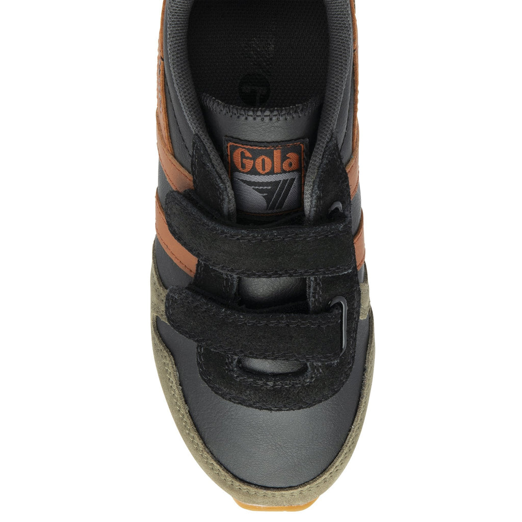 An overhead shot of a single black and brown Gola sneaker with black velcro straps.