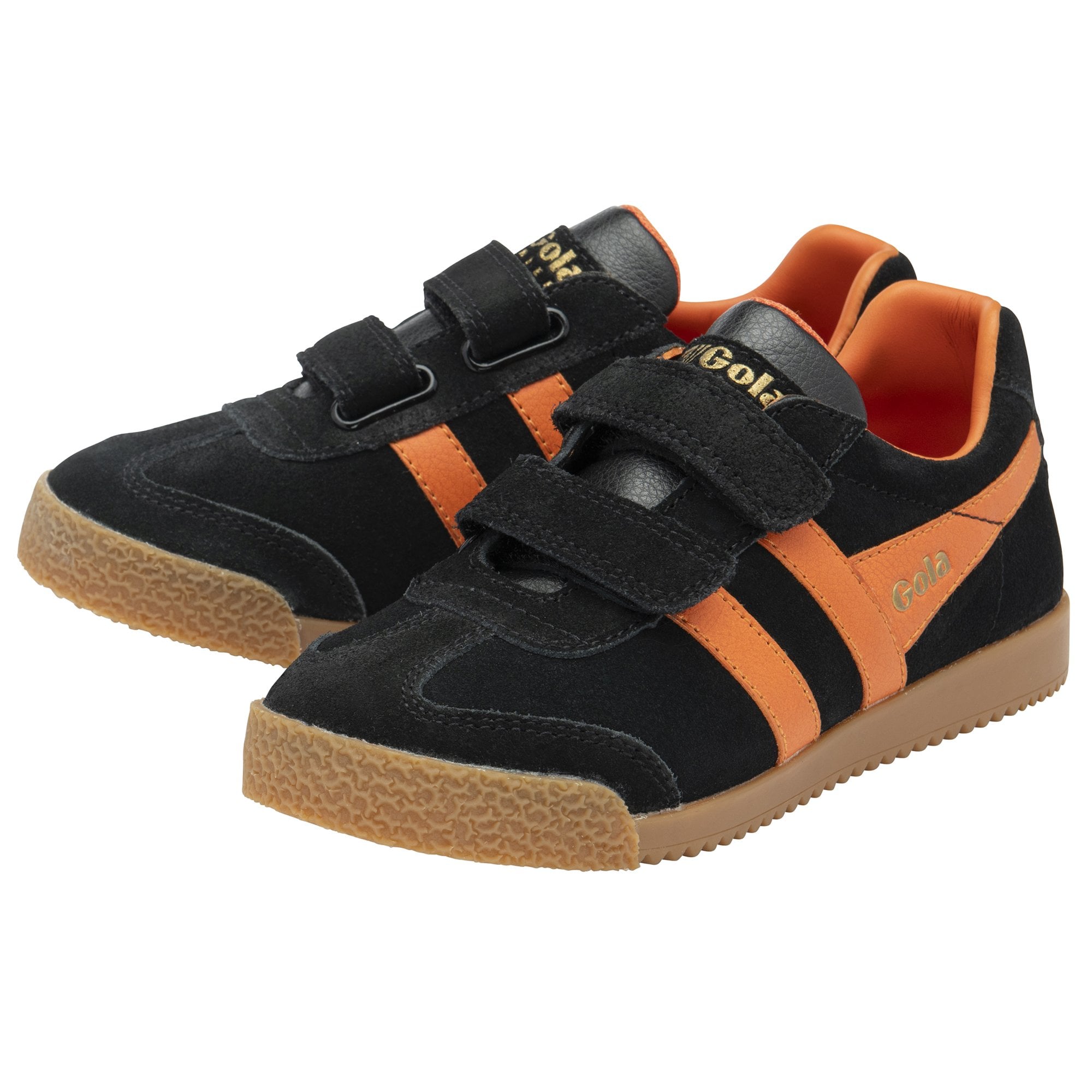 A pair of black and orange Gola kids trainers with velcro straps.
