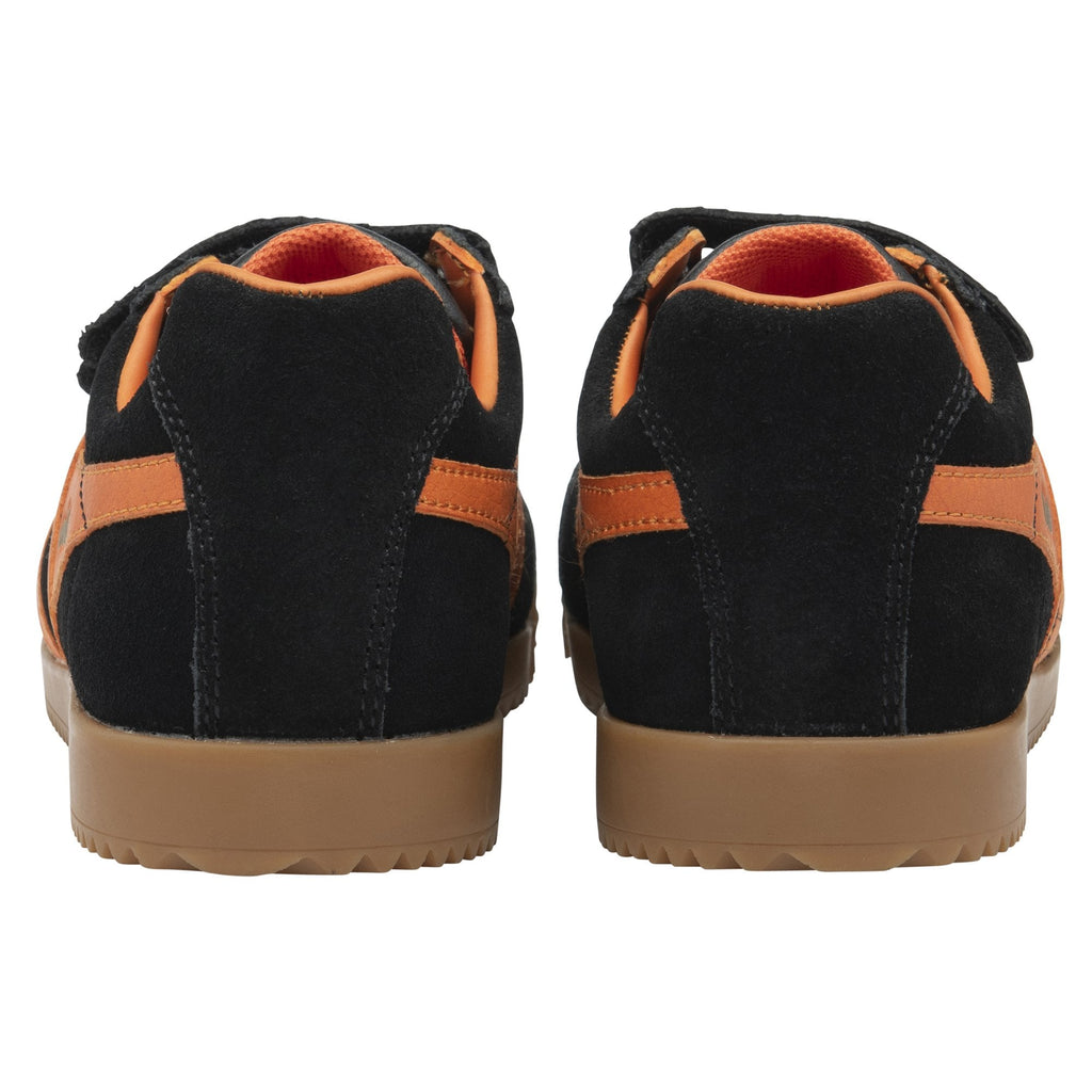 The rear view of a pair of black and orange Gola kids trainers.