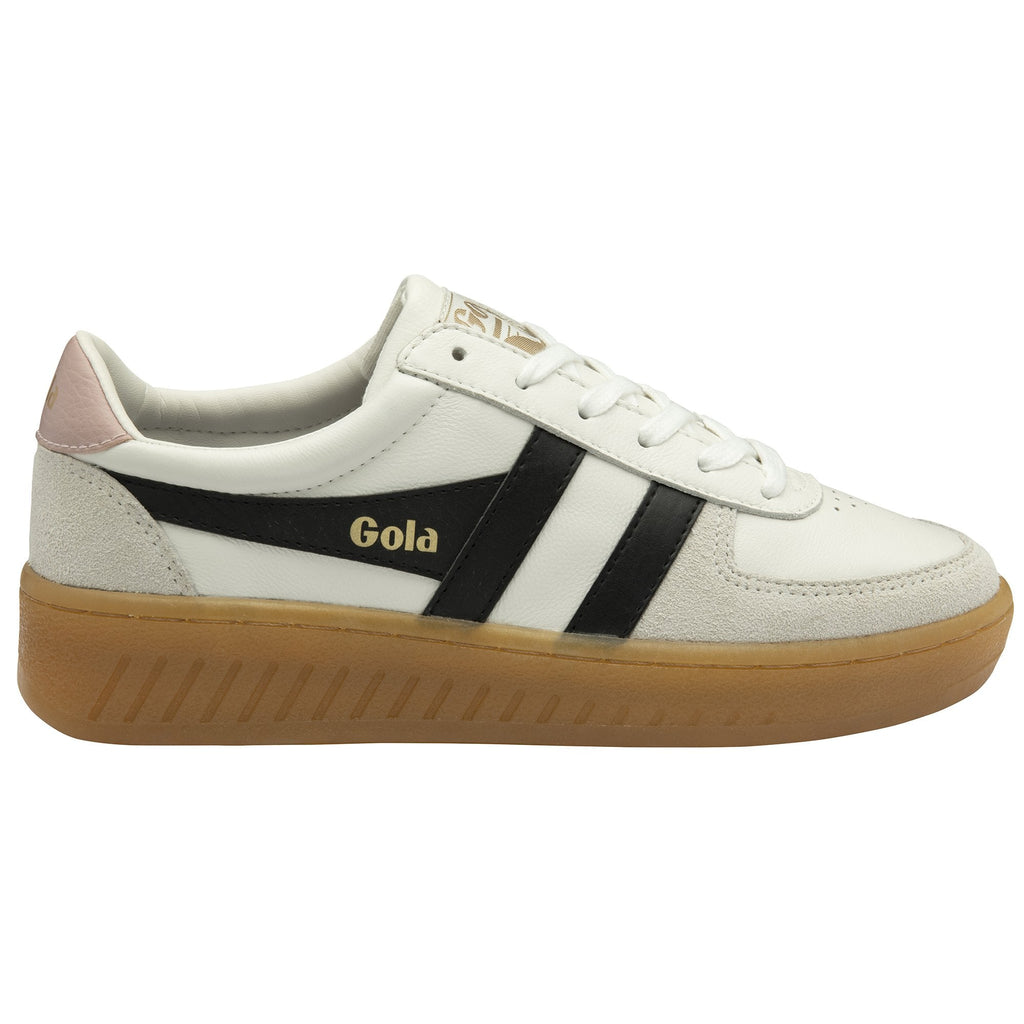 Side profile of a white Gola sneaker with black stripes and a gum sole.