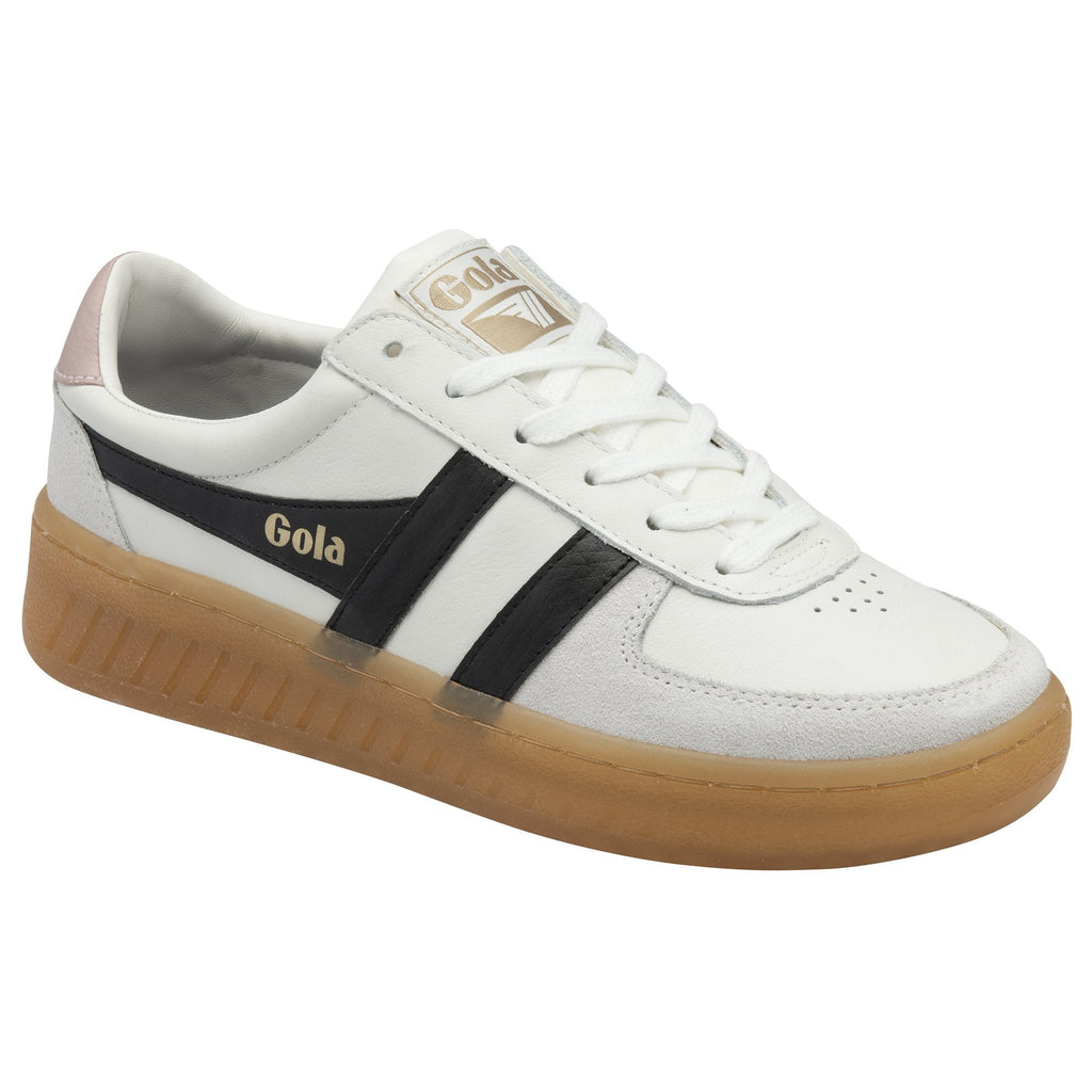 Angled side view of a white Gola sneaker with black stripes and a gum sole.
