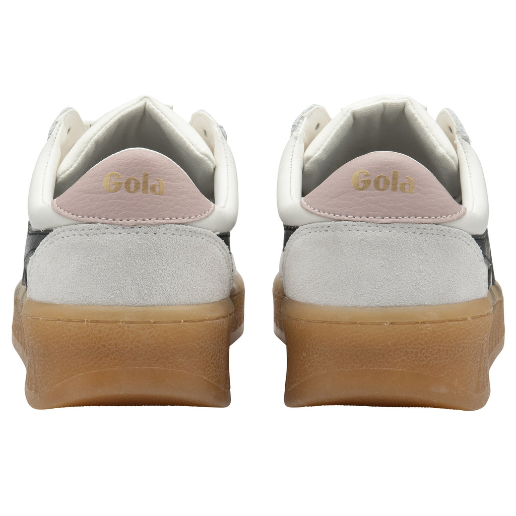 Back view of a pair of white Gola sneakers with pink accents and gum soles.