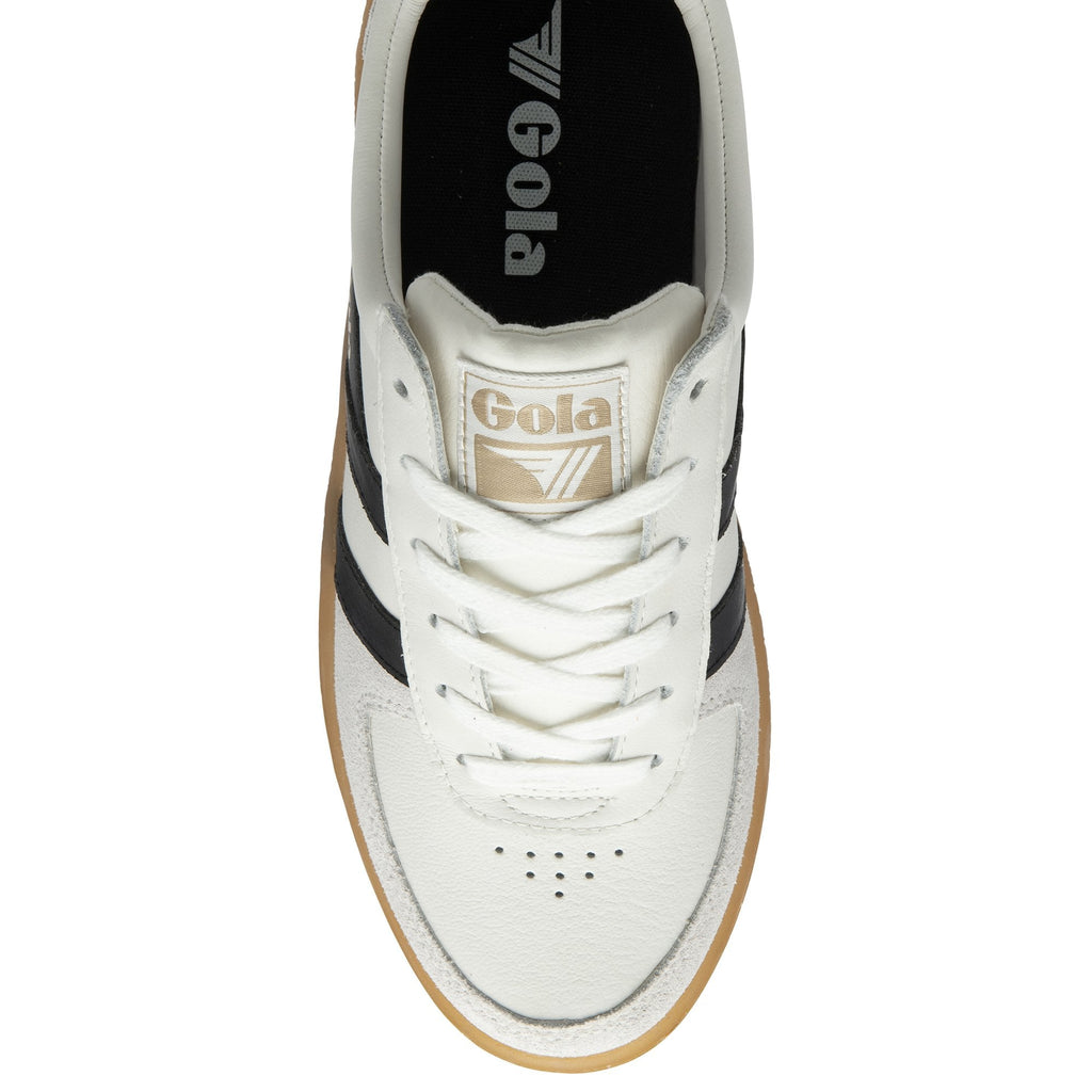 Top-down view of a white Gola sneaker with black stripes and a gum sole.