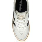 Top-down view of a white Gola sneaker with black stripes and a gum sole.
