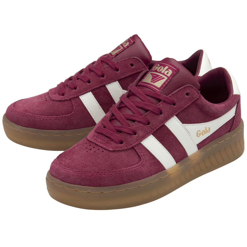 A pair of Gola men's sneakers in burgundy with white stripes from a 3/4 angle.
