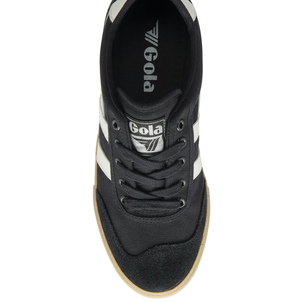 The top-down view of a black Gola trainer with white stripes and gum soles.