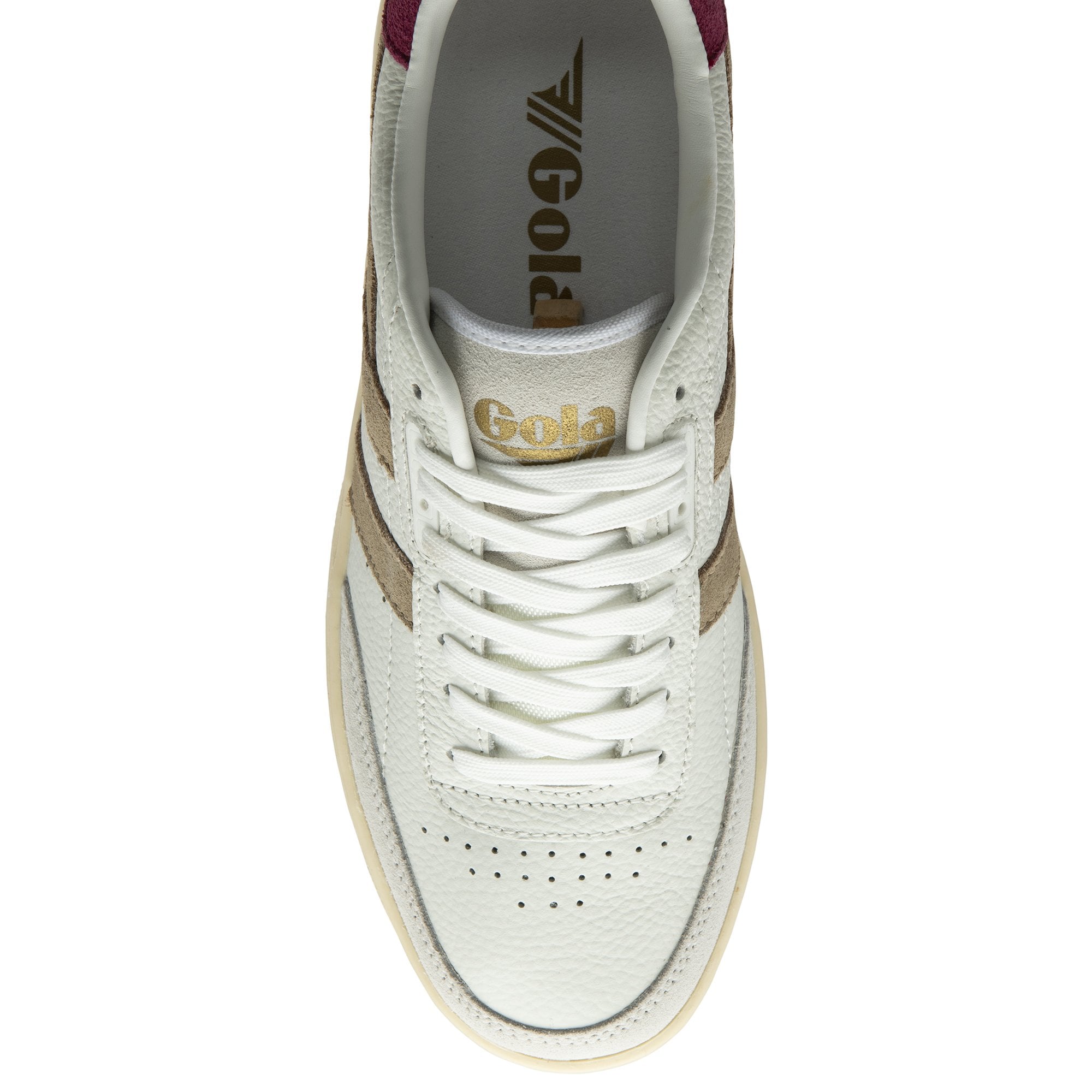 Top-down view of a white and beige sneaker with burgundy accents and white laces.