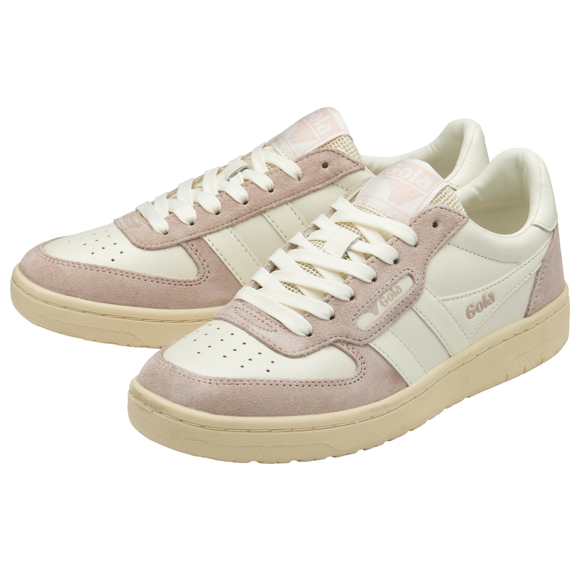 Two pale pink and white sneakers with textured soles are angled on a white background.
