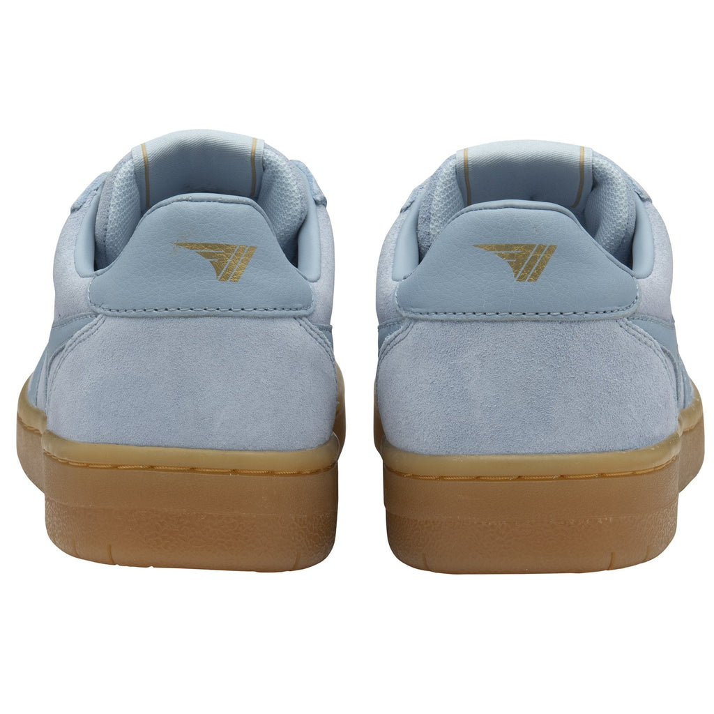 The back view of a pair of light blue Gola sneakers with brown soles.