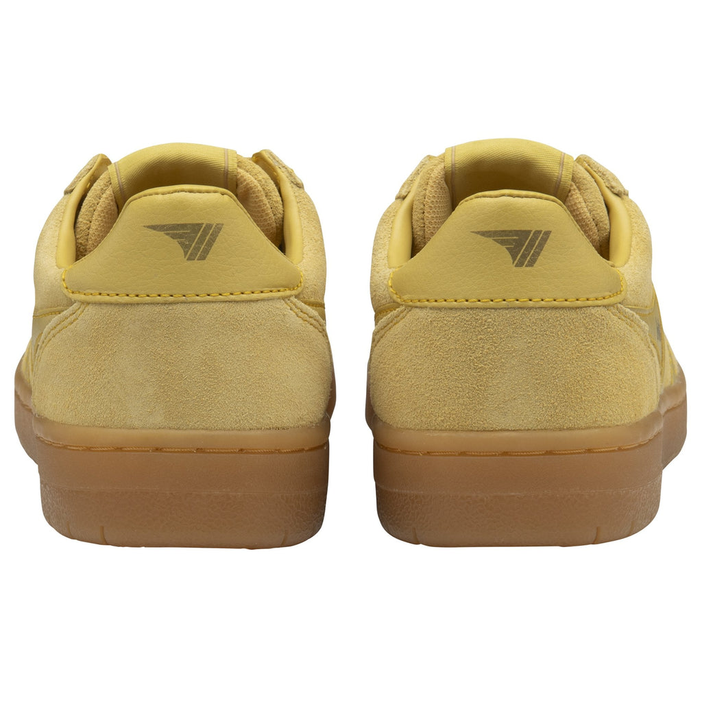 Rear view of two pale yellow Gola low-top suede sneakers with brown rubber soles.