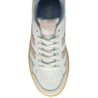 The top-down view of a white Gola sneaker with pink stripes and a gum sole.