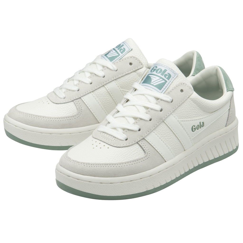 A pair of white Gola sneakers with light green accents, viewed from an angle.