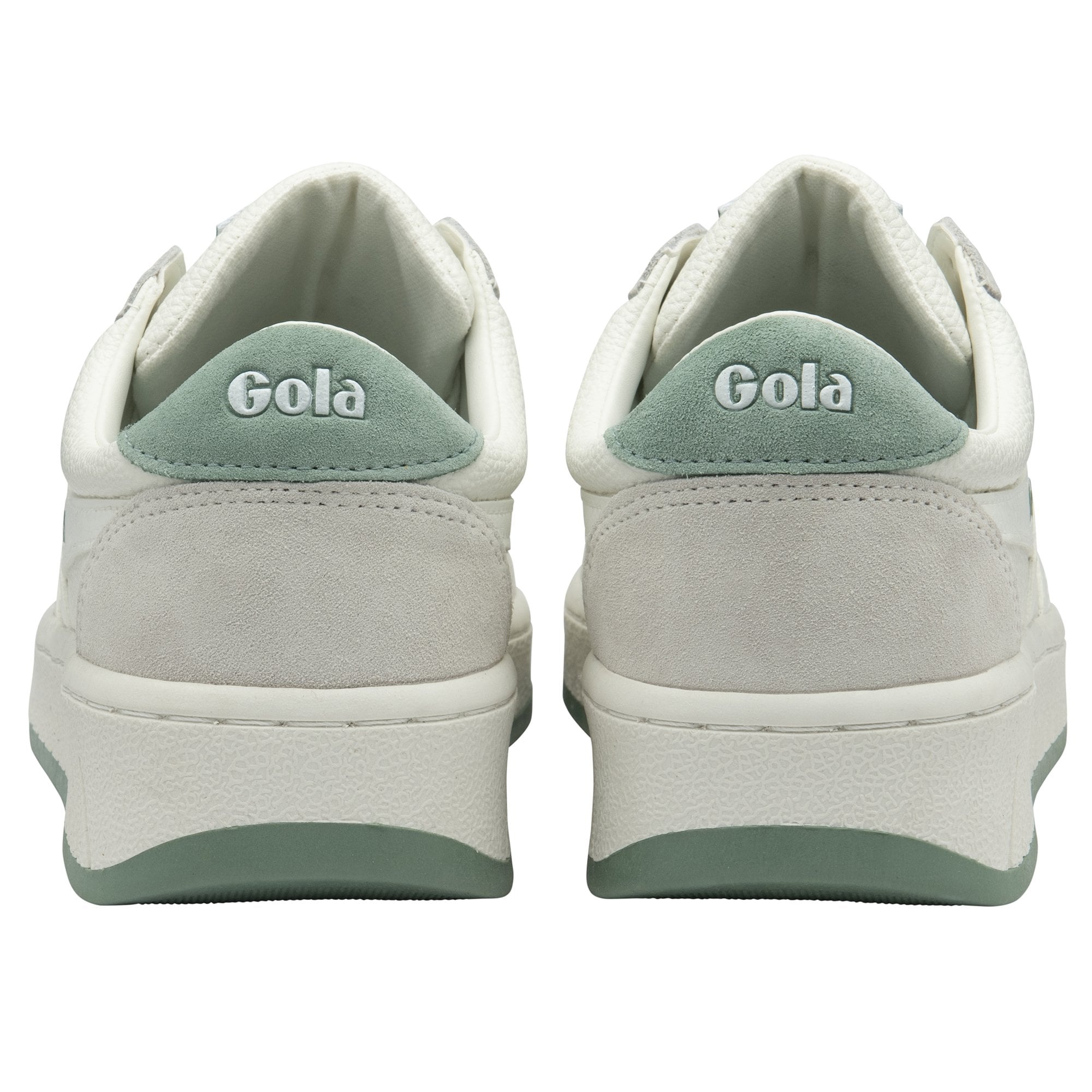 The back of a pair of white Gola sneakers, showing the green heel with the Gola logo.
