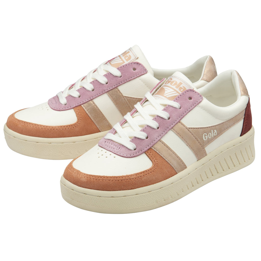 A pair of women's Gola sneakers in white with rose gold and pink accents.
