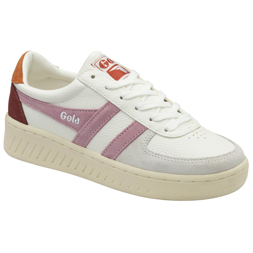 A single white Gola sneaker with a pink stripe and a brown heel, from a three-quarter view.