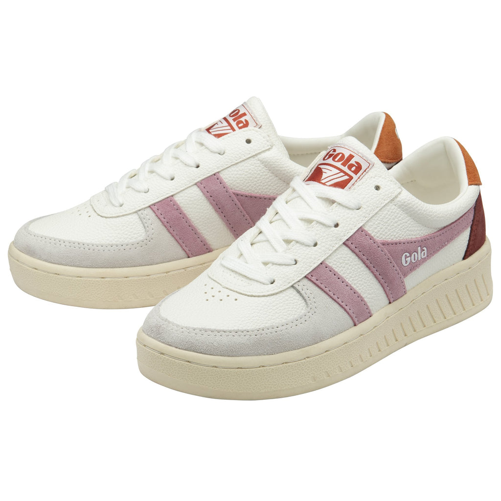 Two white Gola sneakers, with pink stripes and brown heels, in a three-quarter view.