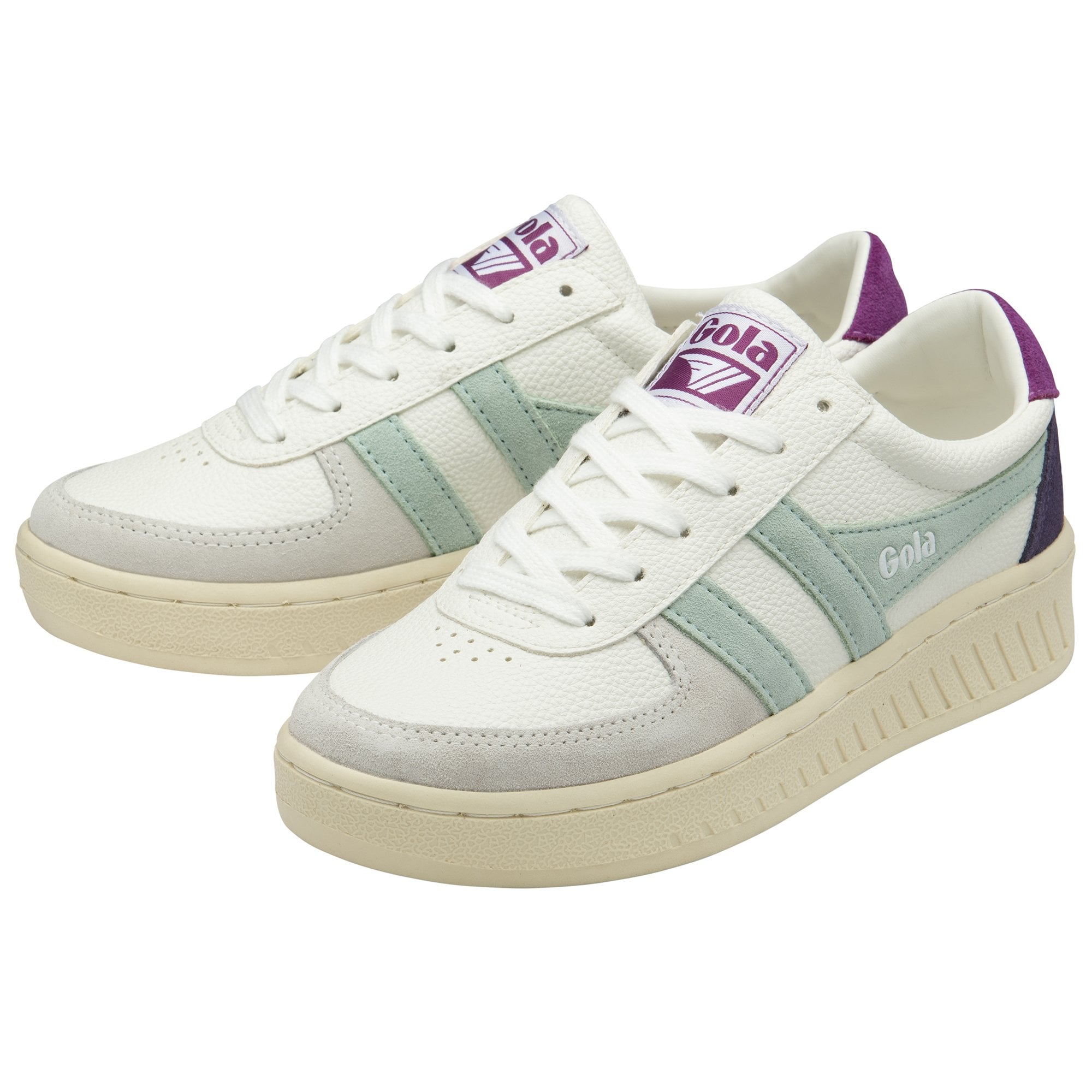 A pair of white Gola sneakers with mint green stripes and purple accents.