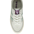 The top-down view of a white Gola sneaker with mint green stripes and purple accents.