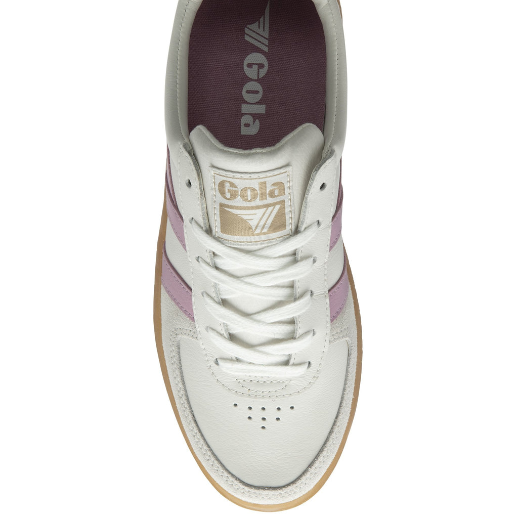 The top-down view of a white Gola sneaker with purple stripes and a gum sole.