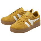 A pair of mustard yellow Gola sneakers with white stripes and brown soles, angled on a white background.