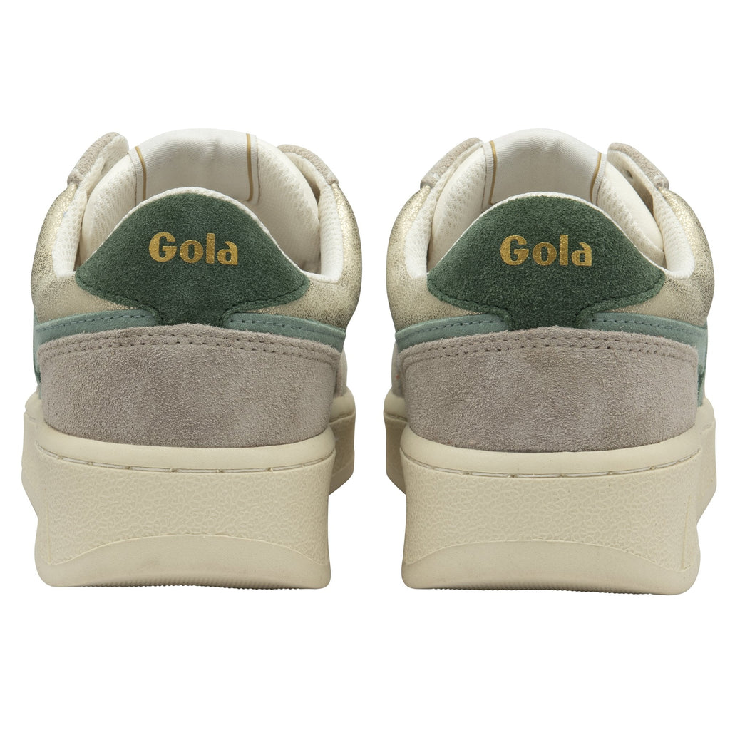 The back view of a pair of Gola women's low-top sneakers in white and green.