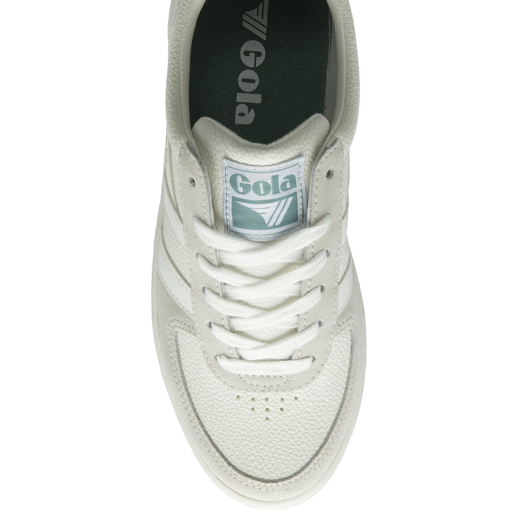 The top-down view of a white Gola sneaker with light green accents.