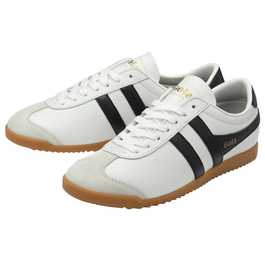 A pair of white and black Gola Bullet sneakers.