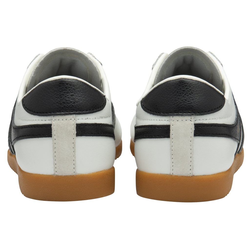 A rear view of two white and black Gola Bullet sneakers.
