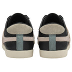 The back view of a pair of black Gola Bullet sneakers with beige and teal accents.
