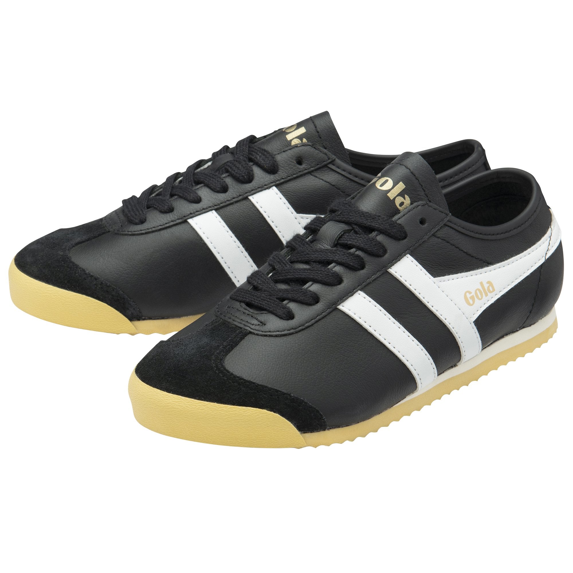 Pair of black and white Gola trainers with gum soles, angled for a dynamic view.