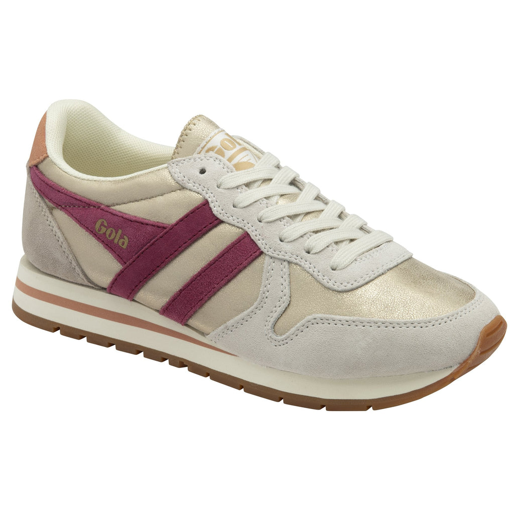 A single Gola women's trainer, in cream, tan and purple, shown from the side.