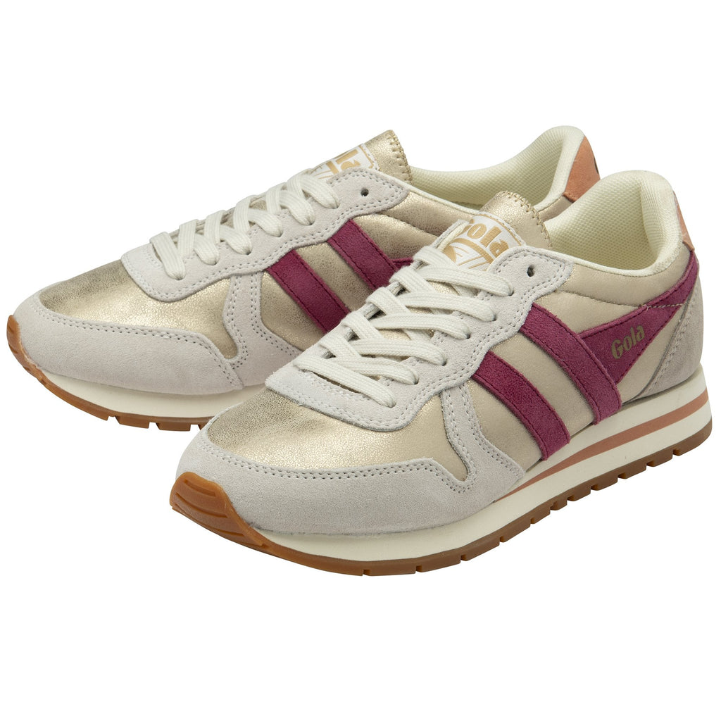 A pair of Gola women's trainers, in cream, tan and purple, shown from the side.