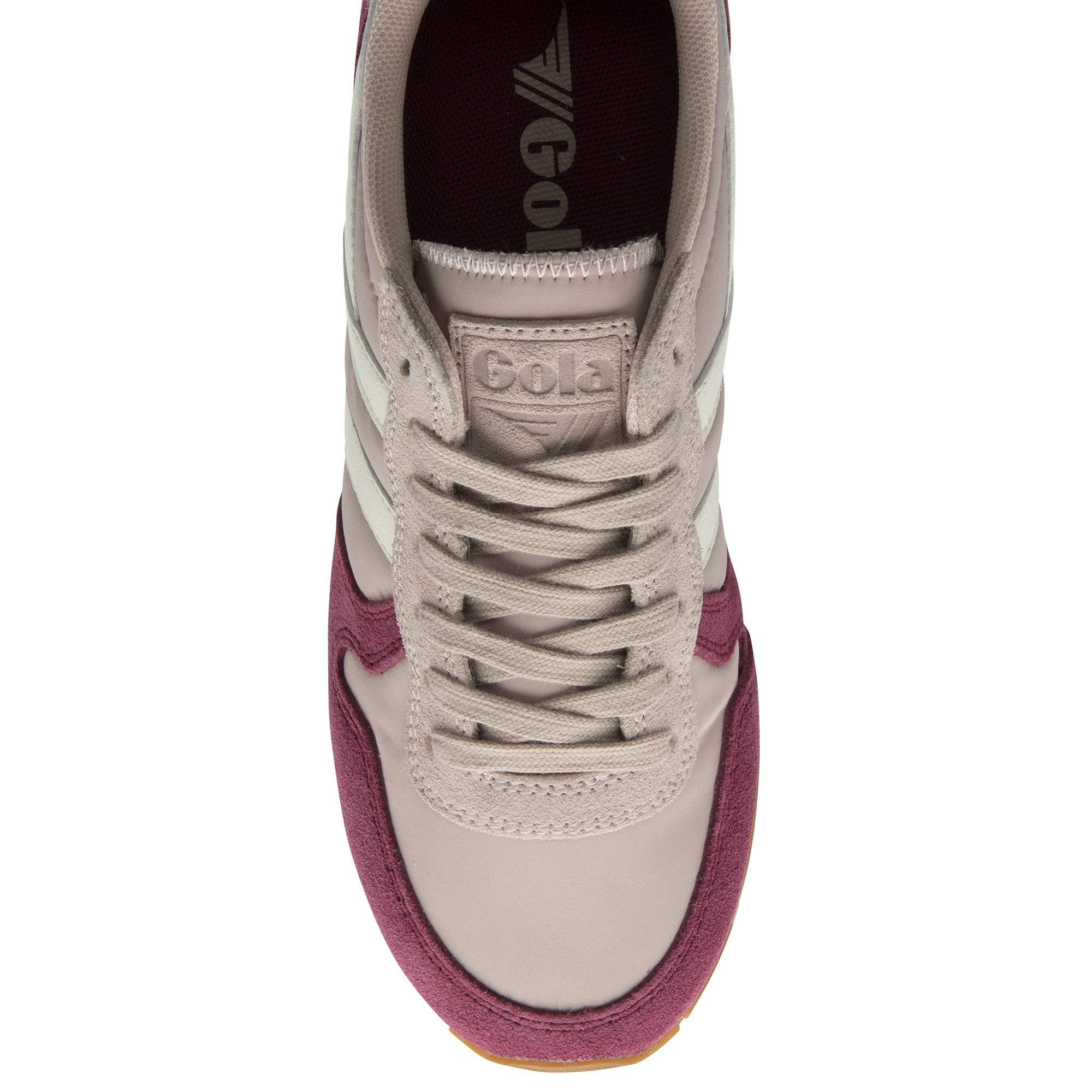 Top down view of a women's Gola trainer, showcasing the laces and shoe tongue.