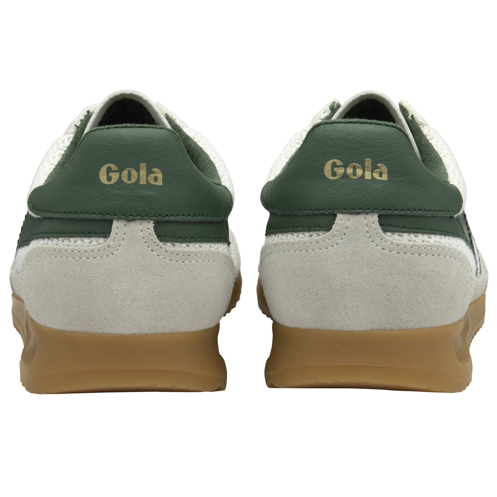 The backs of two white and green Gola sneakers, showing the green heel tab.