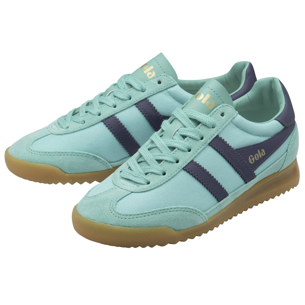A pair of Gola trainers in aqua with dark blue stripes and gum soles, viewed from the side.