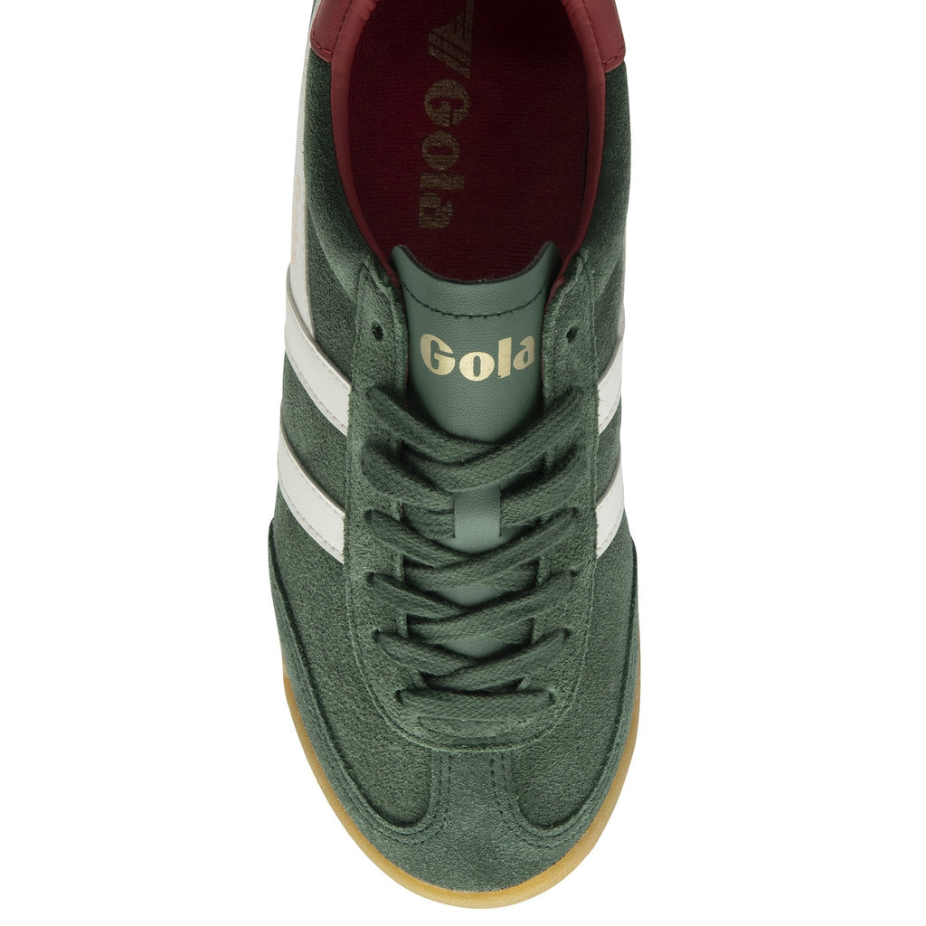 An overhead view of a single green Gola sneaker with white stripes and gum sole.