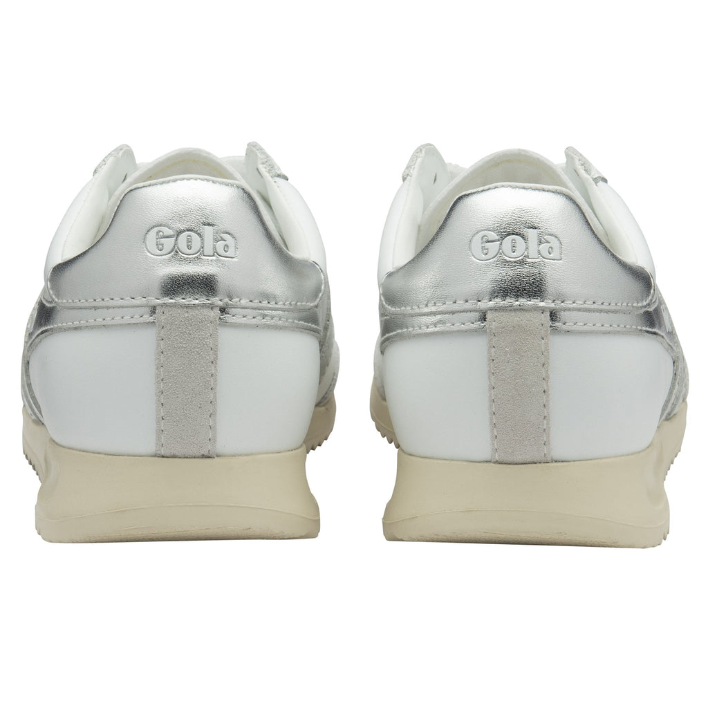 Back view of a pair of white Gola sneakers with silver accents.